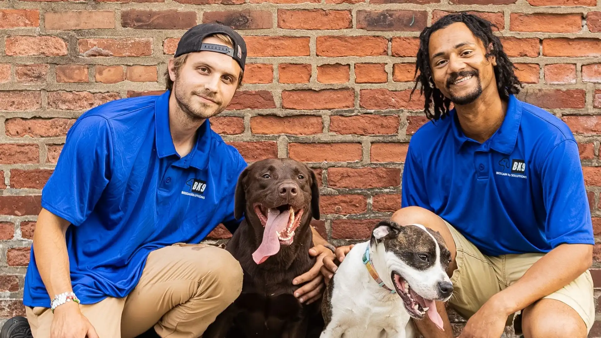 Beegan K9 founders Caden Beegan and Zach Saxton with two dogs